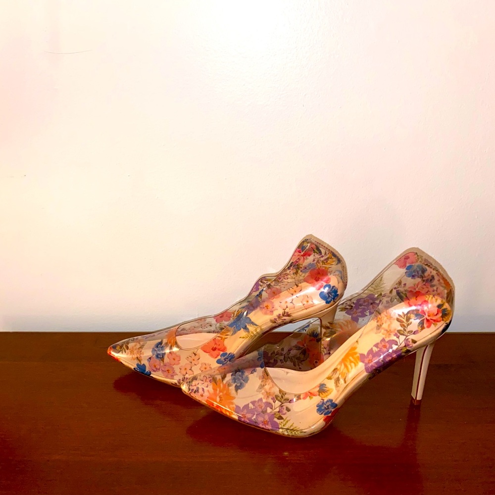 See thru, (plastic) material. Floral. Size 10. Never worn.